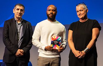 Dr Ayomikun Idowu collecting his award