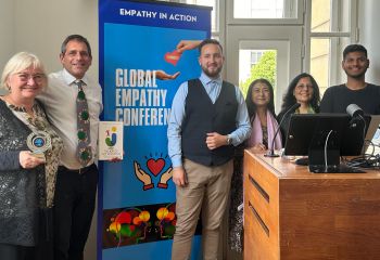 Marcelo Staricoff smiles with others who presented at the 6th Global Empathy Conference in Prague
