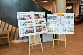 Two easels containing boards with information about West Slope.