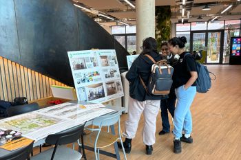 Students looking at West Slope display boards