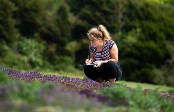 Student conducting research outdoors