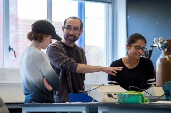 Staff and students in a physics teaching lab