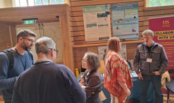 People in a room for launch of Sussex Bay