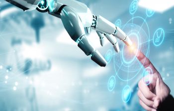 A human index finger touching a robotic index finger