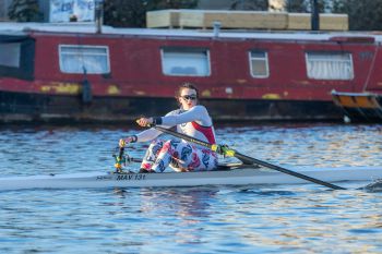 Yasmin Tyson rowing a boat on the river