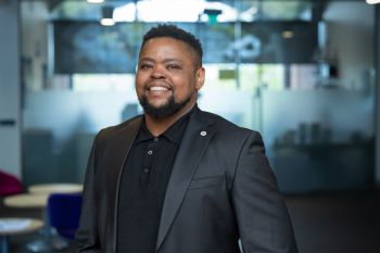 Landa Mabenge smiling at the camera