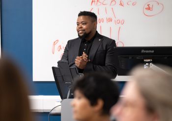 Landa Mabenge delivering his talk, ‘The Sussex Connection: An Iterative Journey of Becoming’ to current Sussex students
