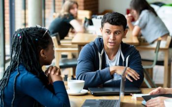 Students having a conversation over a coffee at the ACCA