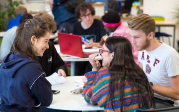 Students gathered around a table