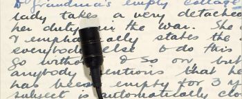 Handwritten wartime letter and oral history microphone