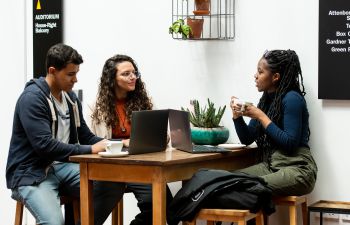 Postgraduate students share a coffee