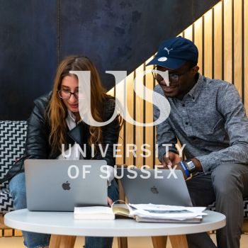Two people looking at a laptop together