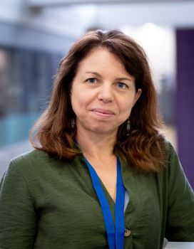 Image of a woman with brown hair, smiling