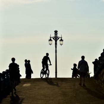People enjoying Brighton promenade