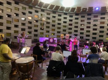 Orchestra of students playing in a chapel