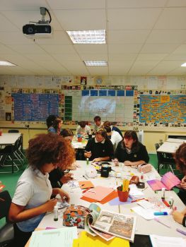 Children learning at school desks in a classroom