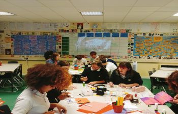 Children learning at school desks in a classroom