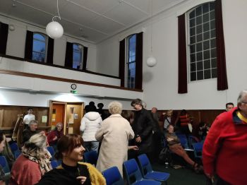 People milling about after the talk.