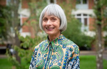 Rosemary Martin on campus smiling at the camera