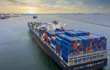 A cargo ship with containers on the sea