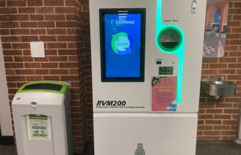 A reverse vending machine (which looks like a big washing machine) in the foyer of Bramber House