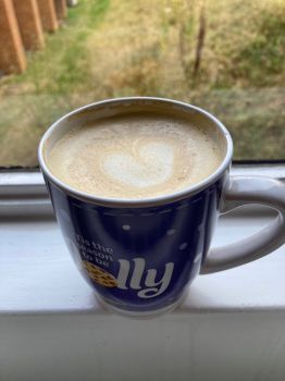 Coffee in a mug on a windowsill