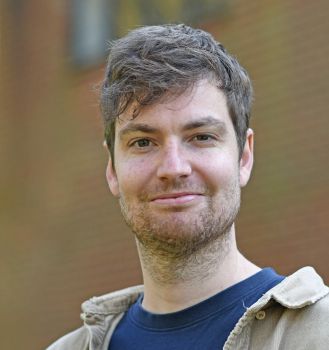 A head and shoulders photo of Dr Guy Fincham