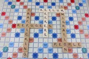 Scrabble board showing words associated with trafficking