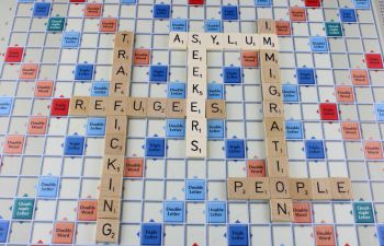 Scrabble board showing words associated with trafficking