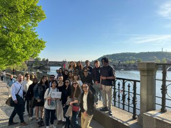 students standing by river in Prague