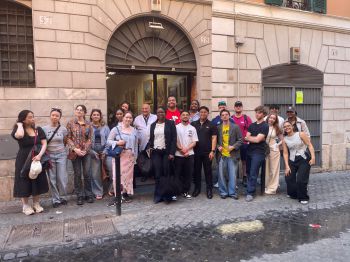 students standing outside building in Rome