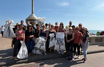 Staff from the Student Advice and Guidance team on Brighton beach