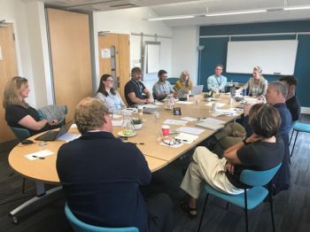 The group discusses the benefits of applying TIPC-developed tools