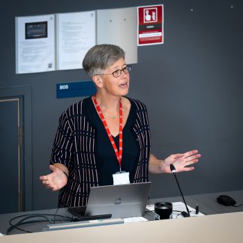 Vice-Chancellor Professor Sasha Roseneil standing at a podium giving a talk