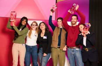 Santander X UK Awards winners holding awards and smiling at the camera