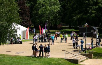Groups of students in Library Square in the sun