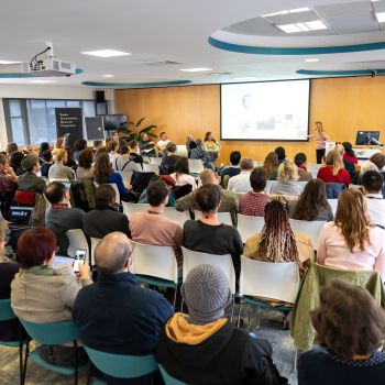 Attendees seated in an auditorium for an event