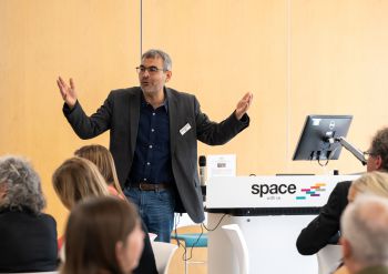 Professor Robin Banerjee giving a presentation during Sussex Court