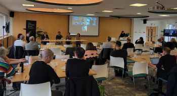 People in a room attending an event