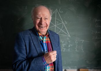 Professor James Hirschfeld smiling at the camera