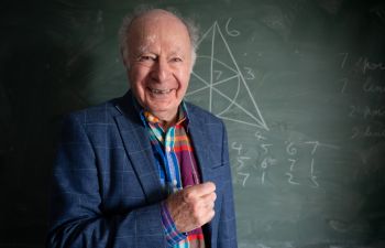 Professor James Hirschfeld smiling at the camera