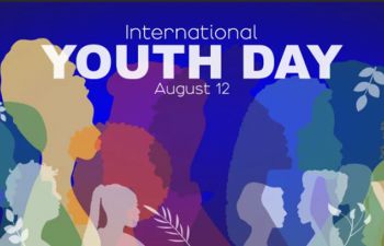 Illustration of diverse youth silhouettes in various colours, facing different directions, against a blue background. The text reads “International Youth Day, August 12” in bold white and light blue font.