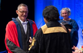 Simon Watney greeting Chancellor Sanjeev Bhaskar