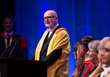 Marcus Hayes MBE during his speech at graduation