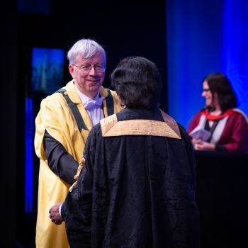 Dr Jonathan MacQuitty greeting Chancellor Sanjeev Bhaskar