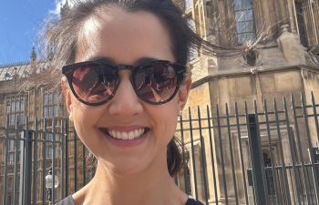 Dr Beatriz Kira outside the Houses of Parliament in London