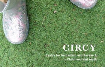 Image of CIRCY Annual Report cover - shows a toddler's legs and little shoes stood on bright green astroturf.