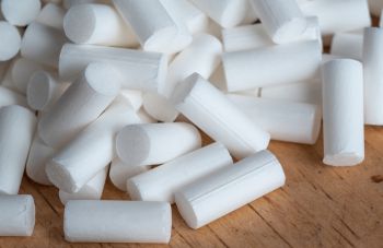 A close up of cigarette filters on a table