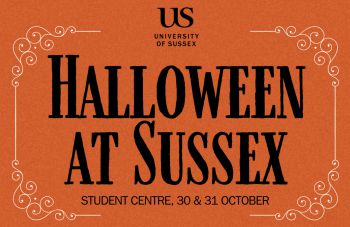 Black text, Halloween at Sussex, on an orange background and a white swirly border