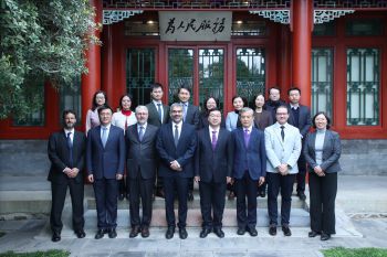 A formal group photo of Chinese and UK faculty standing facing the camera